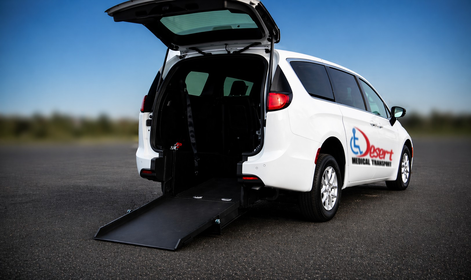 Rear-entry ramp deployed from Desert Medical Transport van